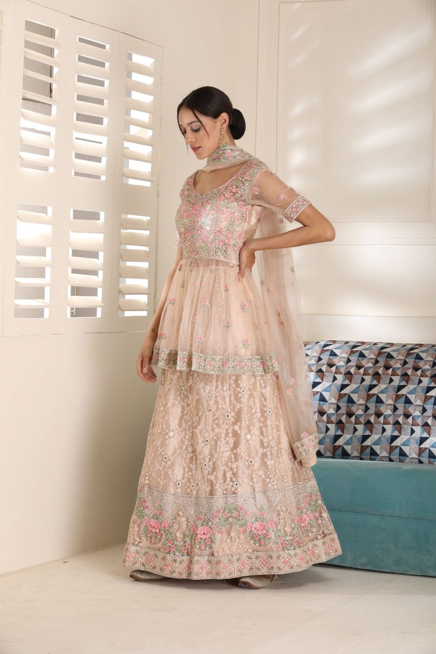 Embroidered Peplum Peach Colour Lehenga